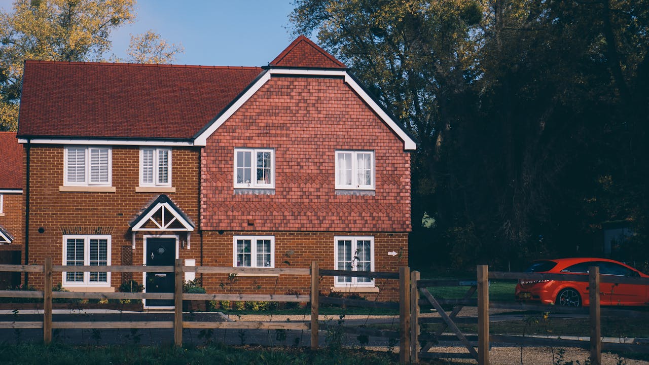 UK estate agent showing property to overseas buyers, professional real estate consultation service